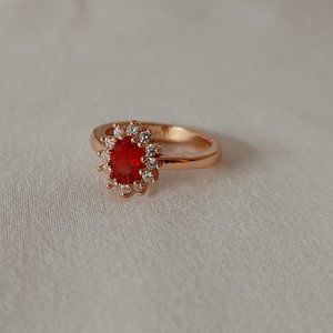 Oval Cut Simulated Garnet Halo in Rose Gold over Sterling Silver Ring